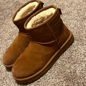 Short brown monogrammed uggs